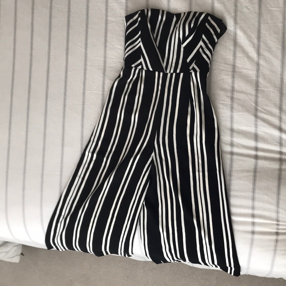 Black strapless jumpsuit with white stripes